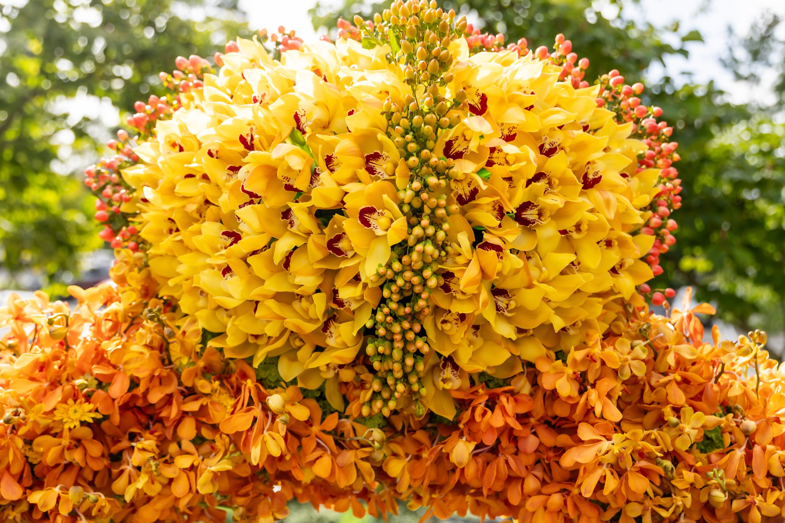 Close-up of yellow flowers forming the gemstone of Pedestals’ floral ring sculpture.